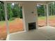 Covered patio with outdoor fireplace and a view of the backyard at 1444 Old Apex Rd, Cary, NC 27513