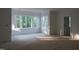 Spacious, unfinished room with large windows offering picturesque outdoor views, ready to be customized at 1444 Old Apex Rd, Cary, NC 27513