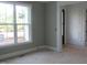 Bright room showcasing a window, wall panel, and doorway at 1444 Old Apex Rd, Cary, NC 27513