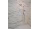 A modern shower with marble tile surround and dual shower heads at 1444 Old Apex Rd, Cary, NC 27513