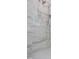 Shower stall featuring adjustable shower head and marble tiling, adding a spa-like experience at 1444 Old Apex Rd, Cary, NC 27513