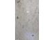 Elegant walk-in shower featuring marble-patterned tile walls and a mosaic tile floor at 1444 Old Apex Rd, Cary, NC 27513