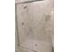 Luxurious shower with glass enclosure and marble-patterned tile at 1444 Old Apex Rd, Cary, NC 27513