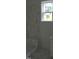 Partially finished shower with marble-patterned tile, built-in bench, and bright window at 1444 Old Apex Rd, Cary, NC 27513