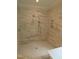 Marble tiled shower with two shower heads at 1444 Old Apex Rd, Cary, NC 27513