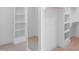 Organized walk-in closet with custom shelving, providing ample storage space and full-length mirror at 1444 Old Apex Rd, Cary, NC 27513