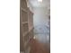 Bright walk-in closet with organized shelving and a small door at 1444 Old Apex Rd, Cary, NC 27513