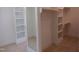A well-organized walk-in closet with shelves and hanging rods at 1444 Old Apex Rd, Cary, NC 27513