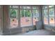 A series of bright windows overlooks the outdoors, offering abundant natural light at 1444 Old Apex Rd, Cary, NC 27513