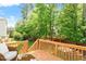 Inviting wooden back deck with scenic views of lush greenery and a tranquil outdoor setting at 1613 Waddell Ct, Durham, NC 27703