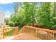 Exterior wooden deck overlooking manicured lawn and lush landscaping at 1613 Waddell Ct, Durham, NC 27703