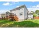Spacious backyard features a screened porch, wooden deck, and a fenced yard, perfect for outdoor living at 1613 Waddell Ct, Durham, NC 27703
