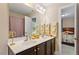 Beautiful bathroom with double sinks, elegant fixtures, and a view to an adjacent bedroom at 1613 Waddell Ct, Durham, NC 27703