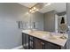 Bright bathroom featuring double sink vanity with modern fixtures and decorative mirror, offering a stylish and functional space at 1613 Waddell Ct, Durham, NC 27703