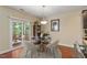 Bright dining area with access to a cozy screened porch at 1613 Waddell Ct, Durham, NC 27703