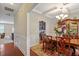 Formal dining area featuring hardwood floors, detailed trim and tray ceiling at 1613 Waddell Ct, Durham, NC 27703