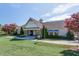 Well-kept community center with lush landscaping, manicured lawn, and inviting entrance beneath a bright, cloud-dotted sky at 1613 Waddell Ct, Durham, NC 27703