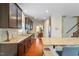 Modern kitchen featuring granite countertops, stainless steel appliances, and a breakfast bar at 1613 Waddell Ct, Durham, NC 27703