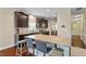 Spacious kitchen with a large island, granite countertops, and modern stainless steel appliances, perfect for cooking at 1613 Waddell Ct, Durham, NC 27703
