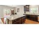 Modern kitchen featuring granite countertops, stainless steel appliances, and a breakfast bar, great for entertaining at 1613 Waddell Ct, Durham, NC 27703