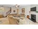 Comfortable living room with a fireplace, plush seating, and a warm, inviting atmosphere at 1613 Waddell Ct, Durham, NC 27703