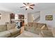Spacious open-concept living area connecting to the kitchen, featuring a ceiling fan and lots of space at 1613 Waddell Ct, Durham, NC 27703
