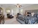 Bedroom with tray ceiling, comfortable seating, and elegant decor. Ideal for relaxation and comfort at 1613 Waddell Ct, Durham, NC 27703