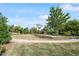 Scenic park featuring walking paths, lush greenery, and a decorative tree structure, perfect for leisure and community gatherings at 1613 Waddell Ct, Durham, NC 27703