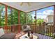 Relaxing screened porch with comfortable seating and scenic views at 1613 Waddell Ct, Durham, NC 27703