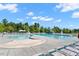 Community swimming pool featuring ample lounge chairs, shade umbrellas, and a water slide at 1613 Waddell Ct, Durham, NC 27703