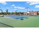 Well-maintained tennis court within a vibrant community, offering ample space for recreational games and sporting activities at 1613 Waddell Ct, Durham, NC 27703