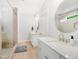 Bright bathroom featuring double vanities, modern fixtures, and a glass-enclosed walk-in shower at 165 Alpine Rd, Moncure, NC 27559