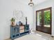 Light and airy foyer featuring wood floors and stylish decor at 165 Alpine Rd, Moncure, NC 27559
