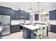 Modern kitchen with white marble countertops and stainless steel appliances at 165 Alpine Rd, Moncure, NC 27559