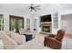 Bright living area featuring a stone fireplace and lots of natural light at 165 Alpine Rd, Moncure, NC 27559