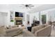 Cozy living room with stone fireplace, built-ins, and comfortable seating at 165 Alpine Rd, Moncure, NC 27559