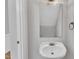 Charming half-bathroom with pedestal sink, decorative mirror, and stylish lighting at 1767 Quince Loop, Sanford, NC 27332
