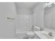 Simple white bathroom with a shower/tub combo and a single sink at 1767 Quince Loop, Sanford, NC 27332