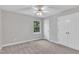 Neutral bedroom with carpet, ceiling fan, window, and closet offers a bright and airy space at 1767 Quince Loop, Sanford, NC 27332