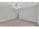 Large, open bedroom with neutral carpet and a ceiling fan at 1767 Quince Loop, Sanford, NC 27332