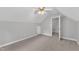 Bedroom with neutral carpet, and access to a hall area at 1767 Quince Loop, Sanford, NC 27332
