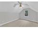Cozy bedroom with sloped ceilings, a ceiling fan, and a window at 1767 Quince Loop, Sanford, NC 27332