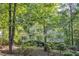 Inviting two-story home nestled among towering trees, creating a private and peaceful atmosphere at 1767 Quince Loop, Sanford, NC 27332