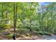Beautiful two-story house surrounded by vibrant trees and lush landscaping, offering a serene setting at 1767 Quince Loop, Sanford, NC 27332