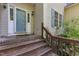 Inviting front entrance with brick steps, and a blue door, offering a warm welcome at 1767 Quince Loop, Sanford, NC 27332