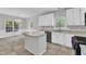 Well-equipped kitchen with granite countertops, ample storage space, and a breakfast nook at 1767 Quince Loop, Sanford, NC 27332