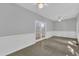 Bright living room featuring a decorative chair rail, tiled floor, and glass paned doors at 1767 Quince Loop, Sanford, NC 27332