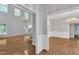 Spacious living area with hardwood floors, soaring ceilings, and elegant chandeliers, exuding sophistication at 1767 Quince Loop, Sanford, NC 27332