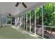 Enclosed back porch offers a relaxing space with views of the lush backyard at 1767 Quince Loop, Sanford, NC 27332