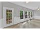 Sunroom with multiple windows, a ceiling fan, neutral walls and tile flooring at 1767 Quince Loop, Sanford, NC 27332